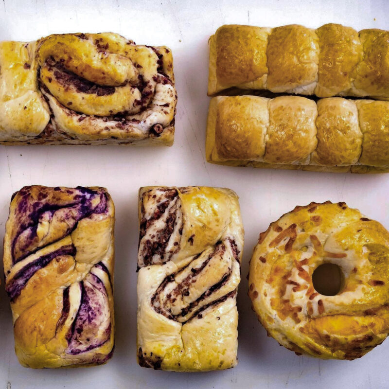 a variety of bread loaves on a table