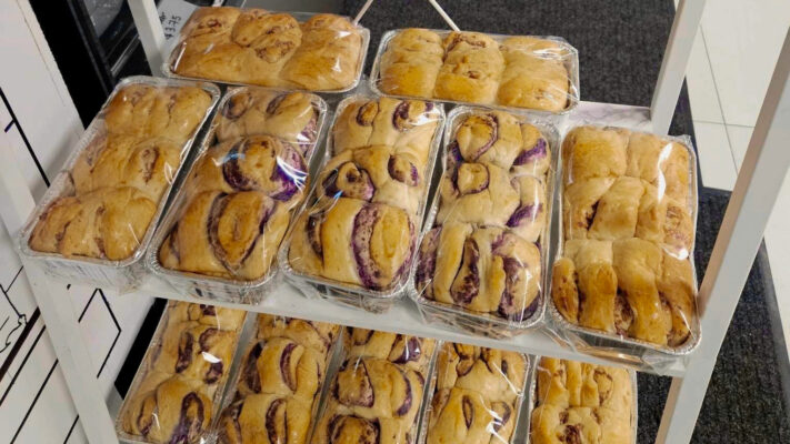 a rack of packaged bread loaves