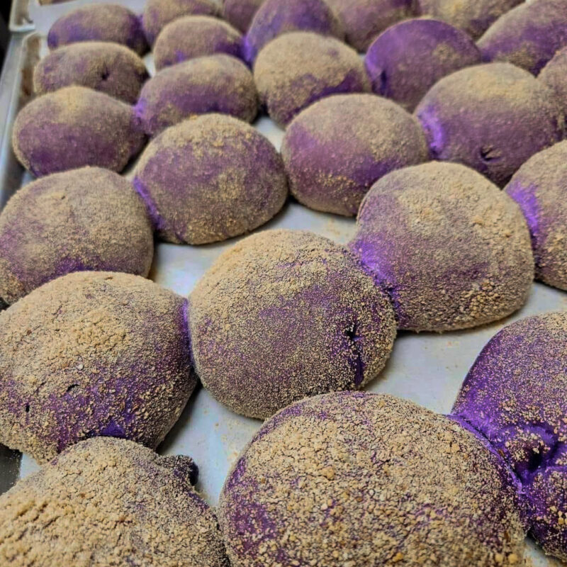 vibrant purple bread on a baking tray